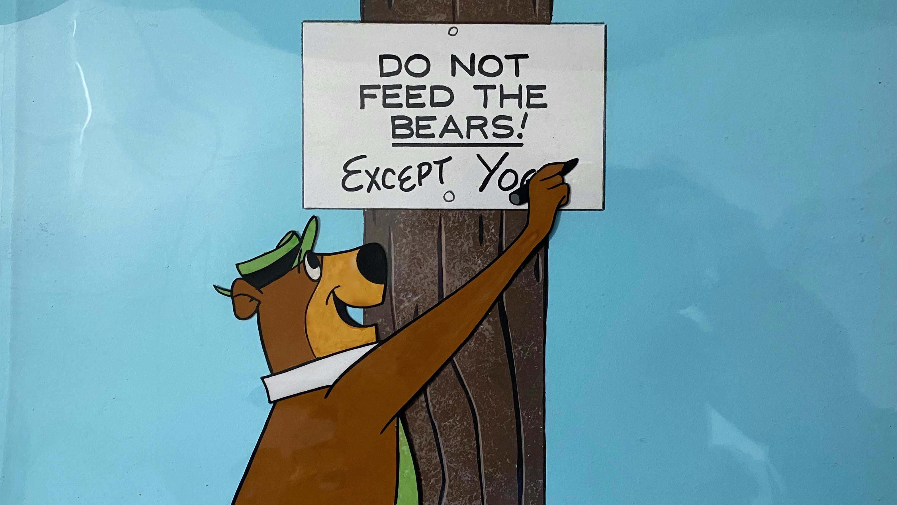 An animation cel from the opening of Hanna Barbera's "The Yogi Bear Show" from 1961. Yogi was a breakout hit for Hanna-Barbera, becoming one of the most popular and iconic cartoon characters of the 1960s.