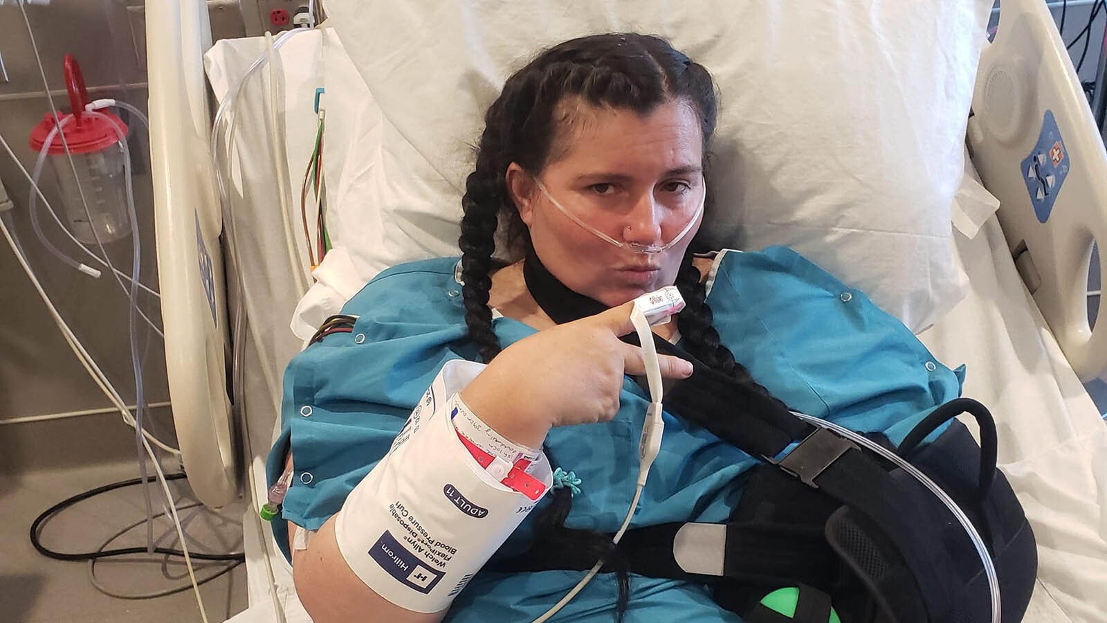 Karla Smith shown recovering after she was stabbed in the back by her son. The family raised money for her medical bills by raffling off the son's pigs.